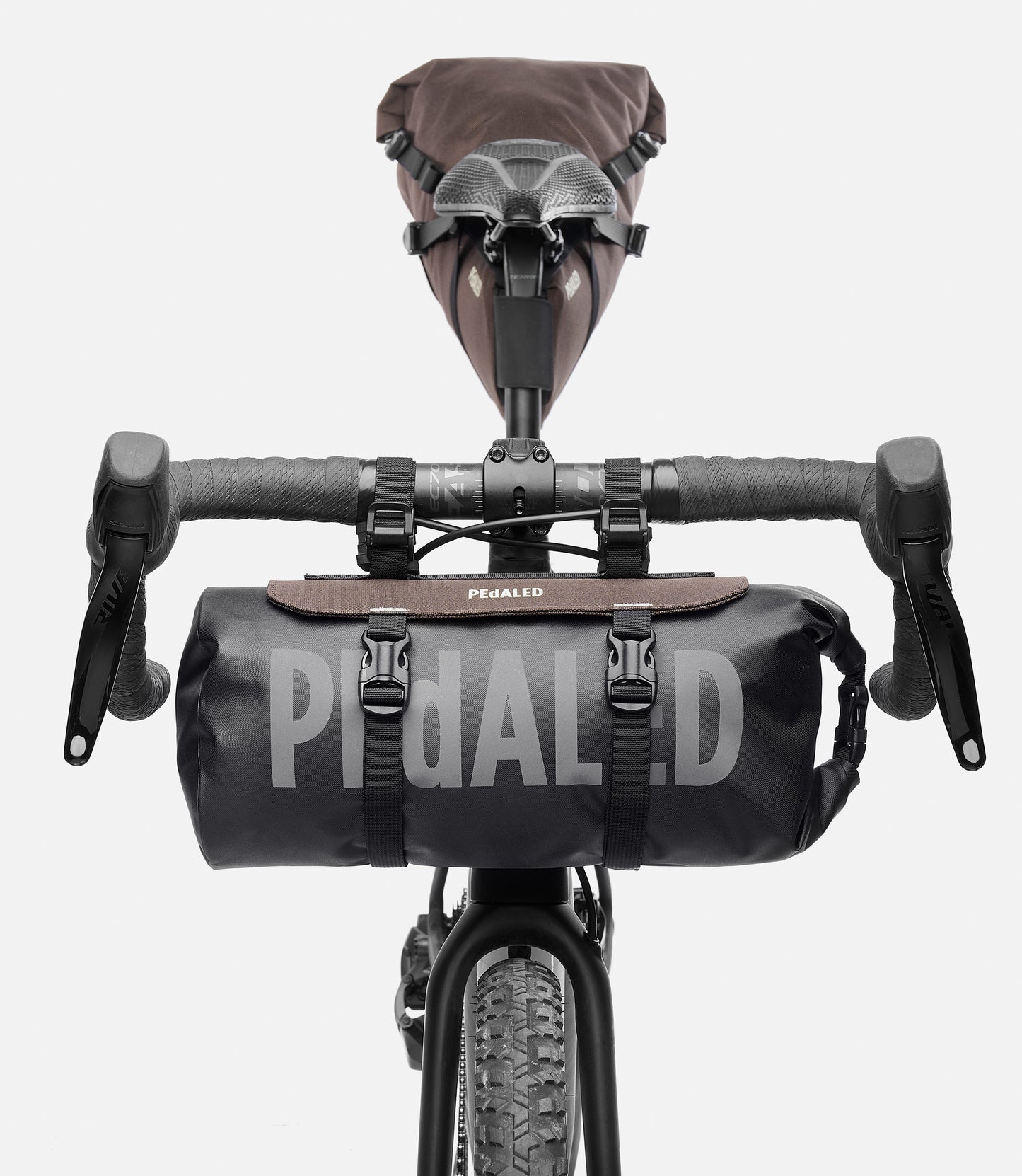 244HBOD14PE_3_bikepacking handlebar bag brown bike detail pedaled