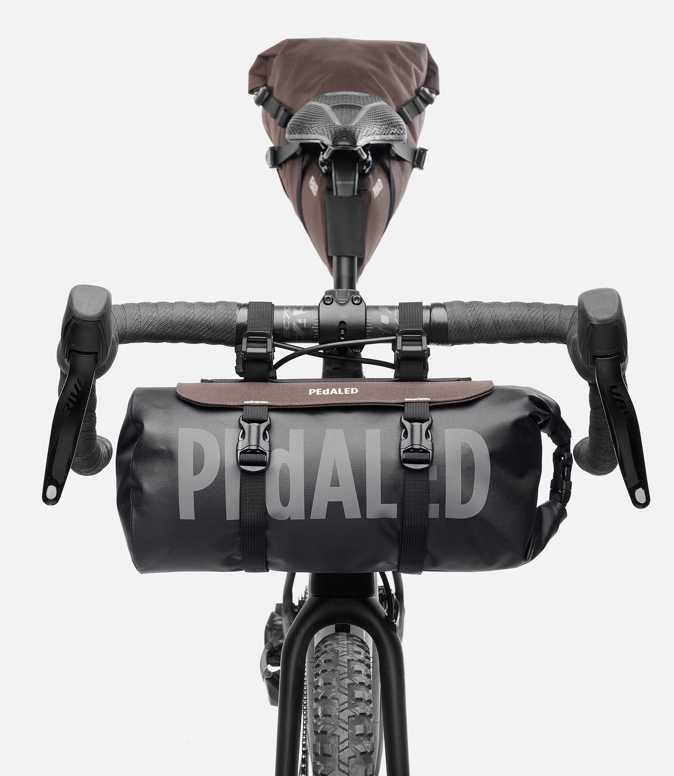 244HBOD14PE_3_bikepacking handlebar bag brown bike detail pedaled