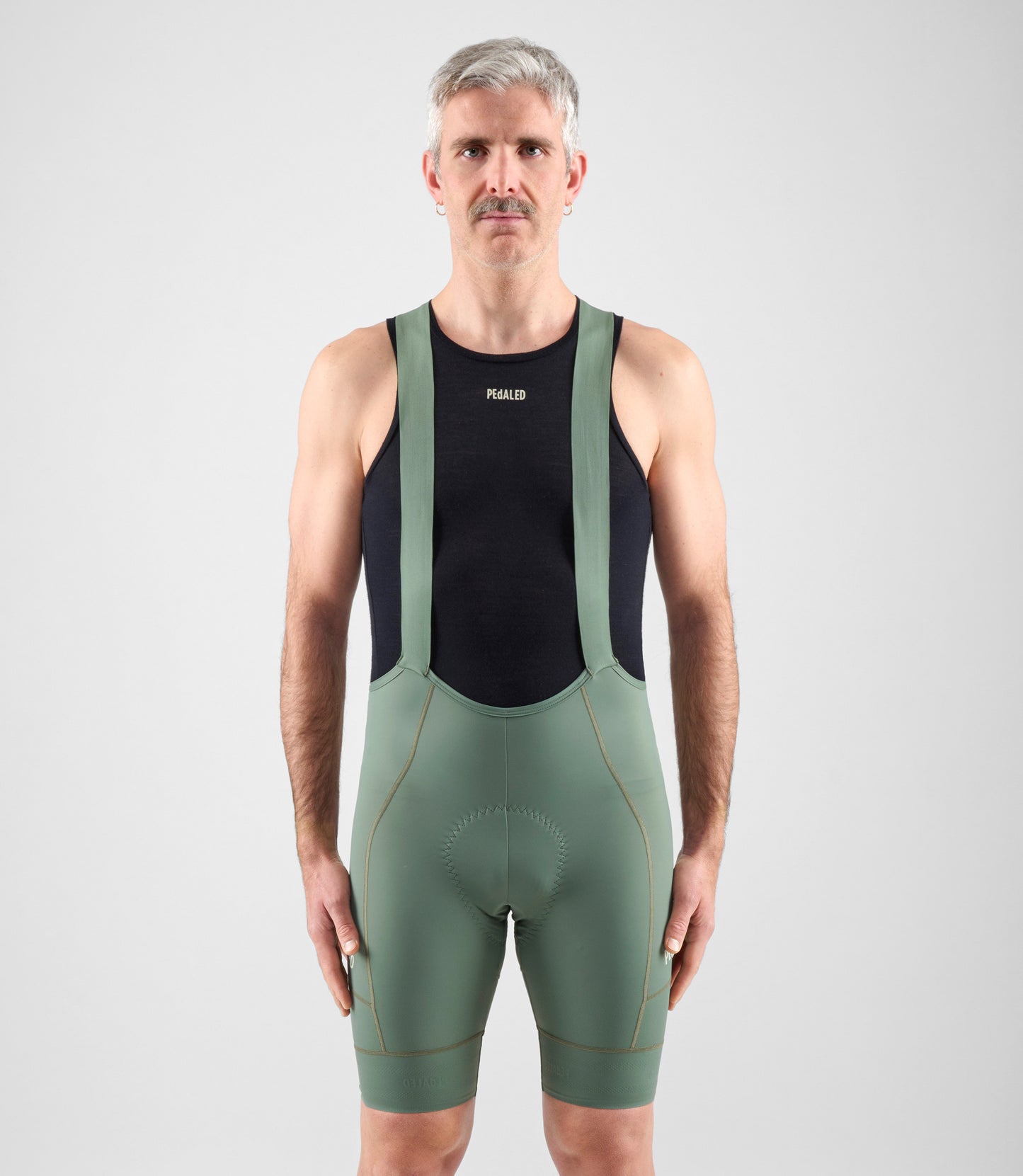 24SMBEL00PE_3_men cycling baselayer merino element black total body front pedaled