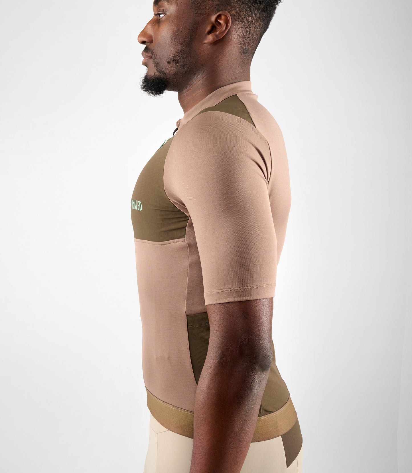 24SMJOD14PE_8_cycling cargo jersey men brown odyssey side pedaled 1