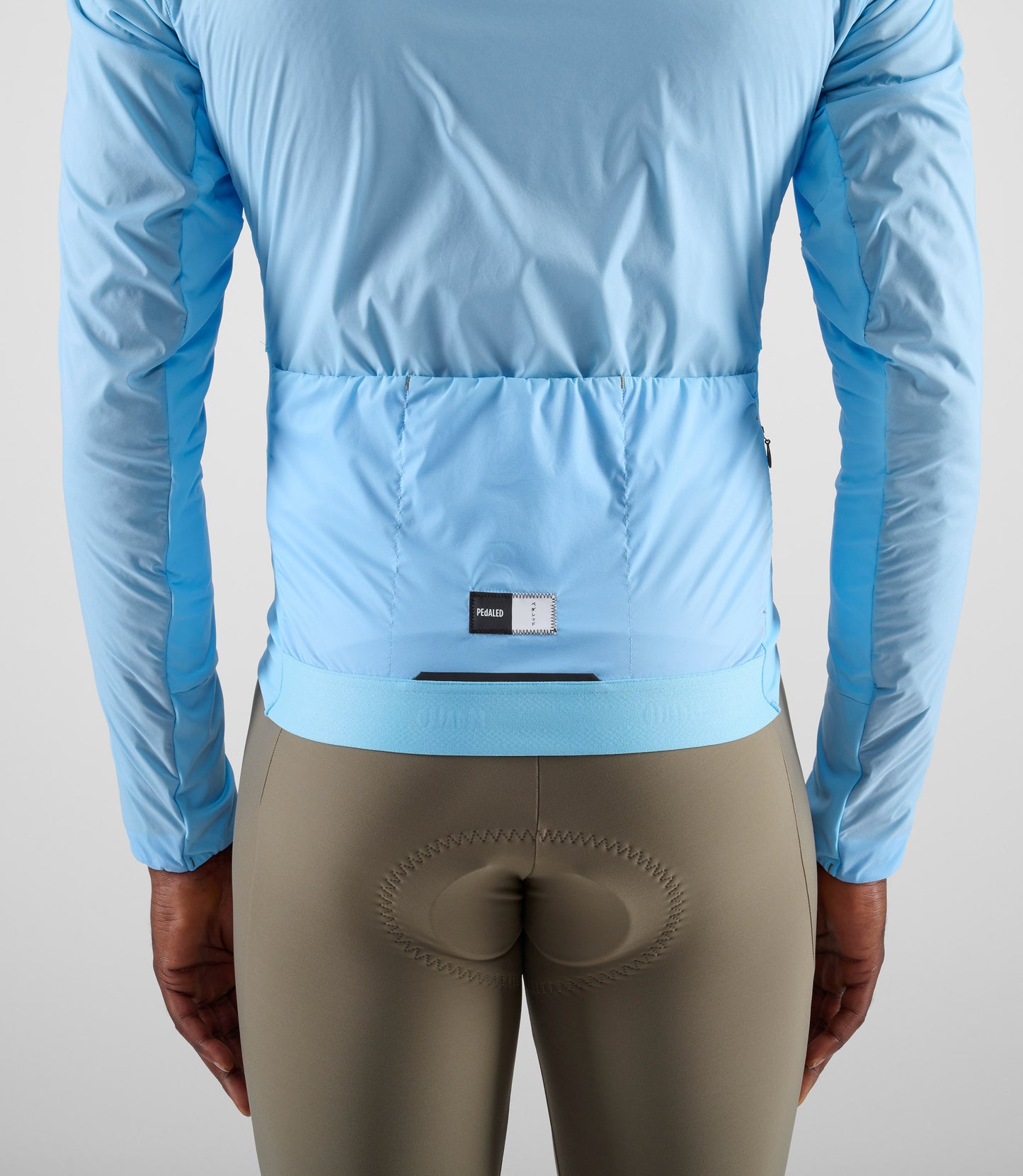 24WAJEL08PE_8_men cycling jacket alpha light blue element back pocket pedaled