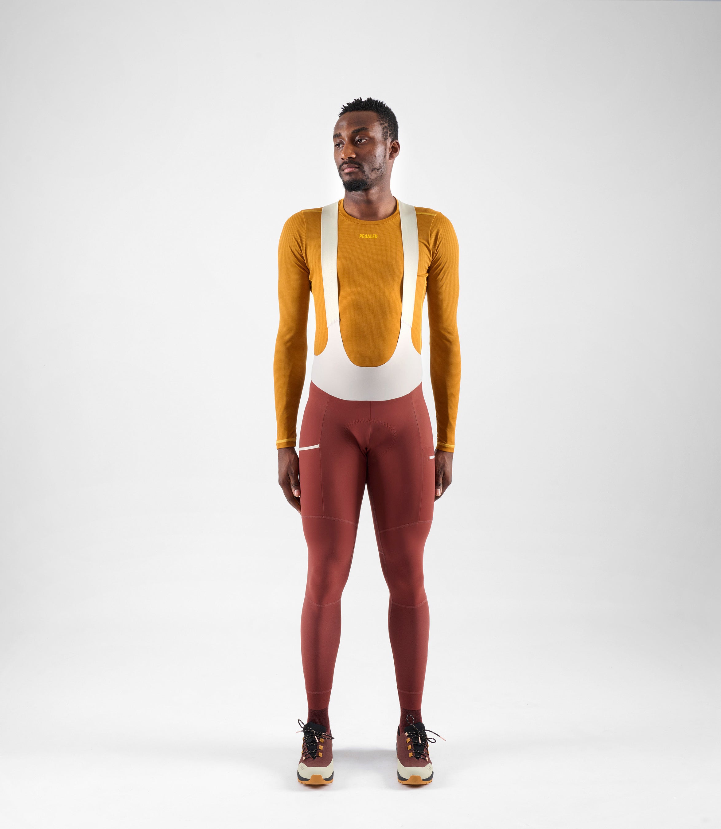 24WBLOD14PE_3_men cycling base layer long sleeve brown odyssey total body front pedaled