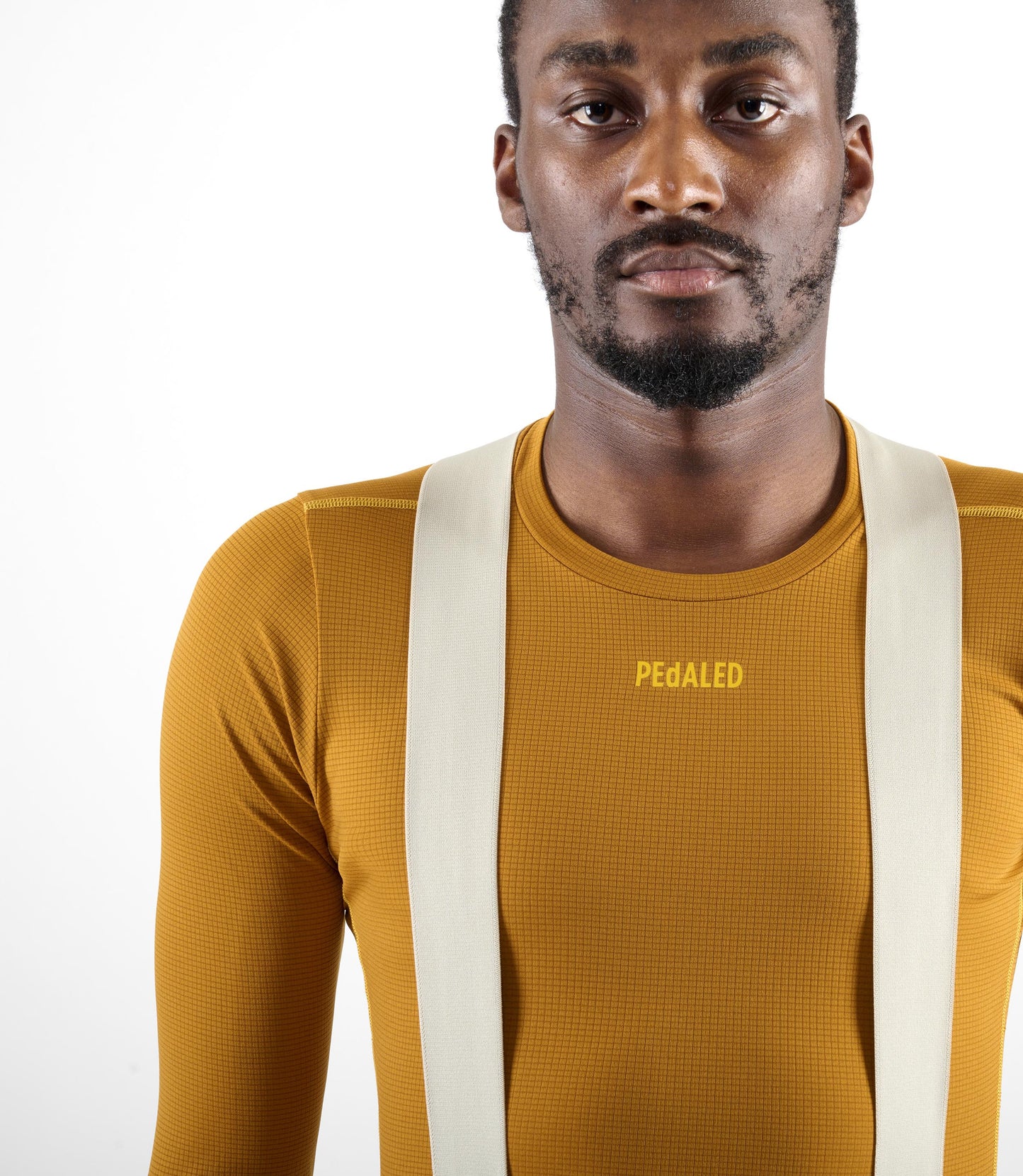 24WBLOD14PE_5_men cycling base layer long sleeve brown odyssey front pedaled