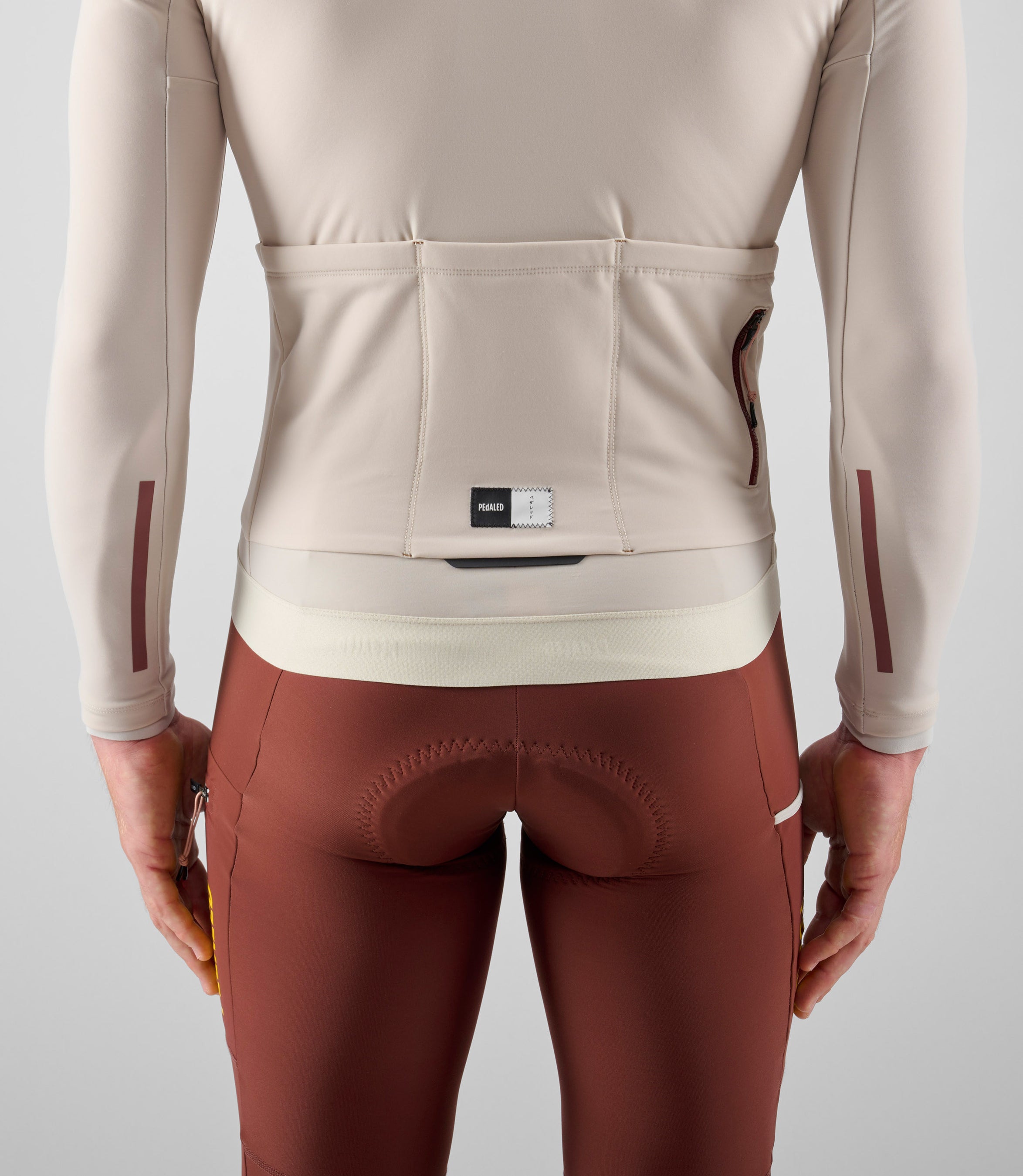 24WJSOD0GPE_5_men cycling jersey cargo long sleeve off white odyssey back pocket pedaled