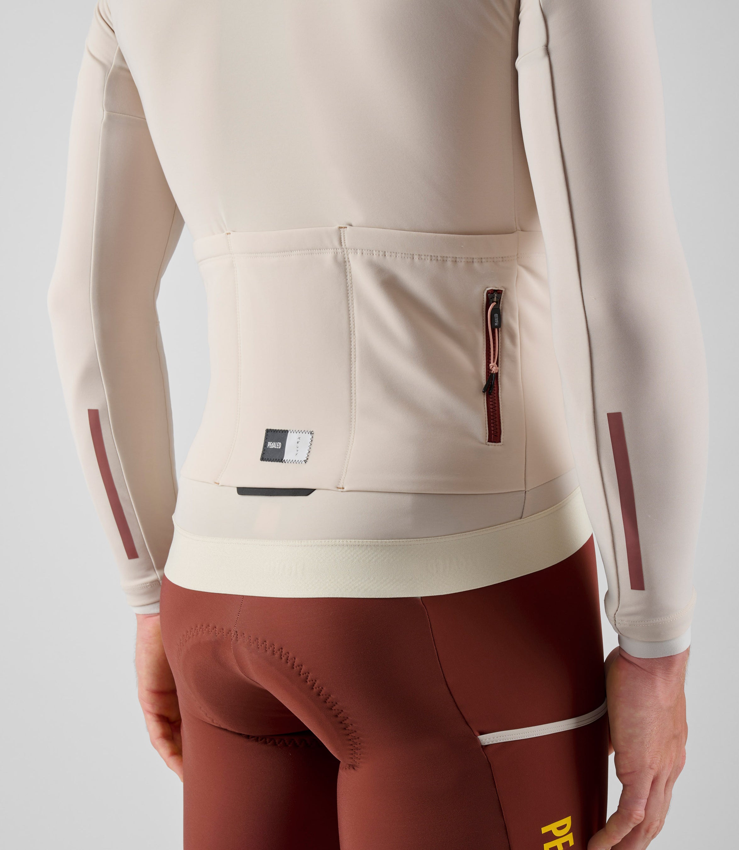 24WJSOD0GPE_7_men cycling jersey cargo long sleeve off white odyssey side pocket pedaled