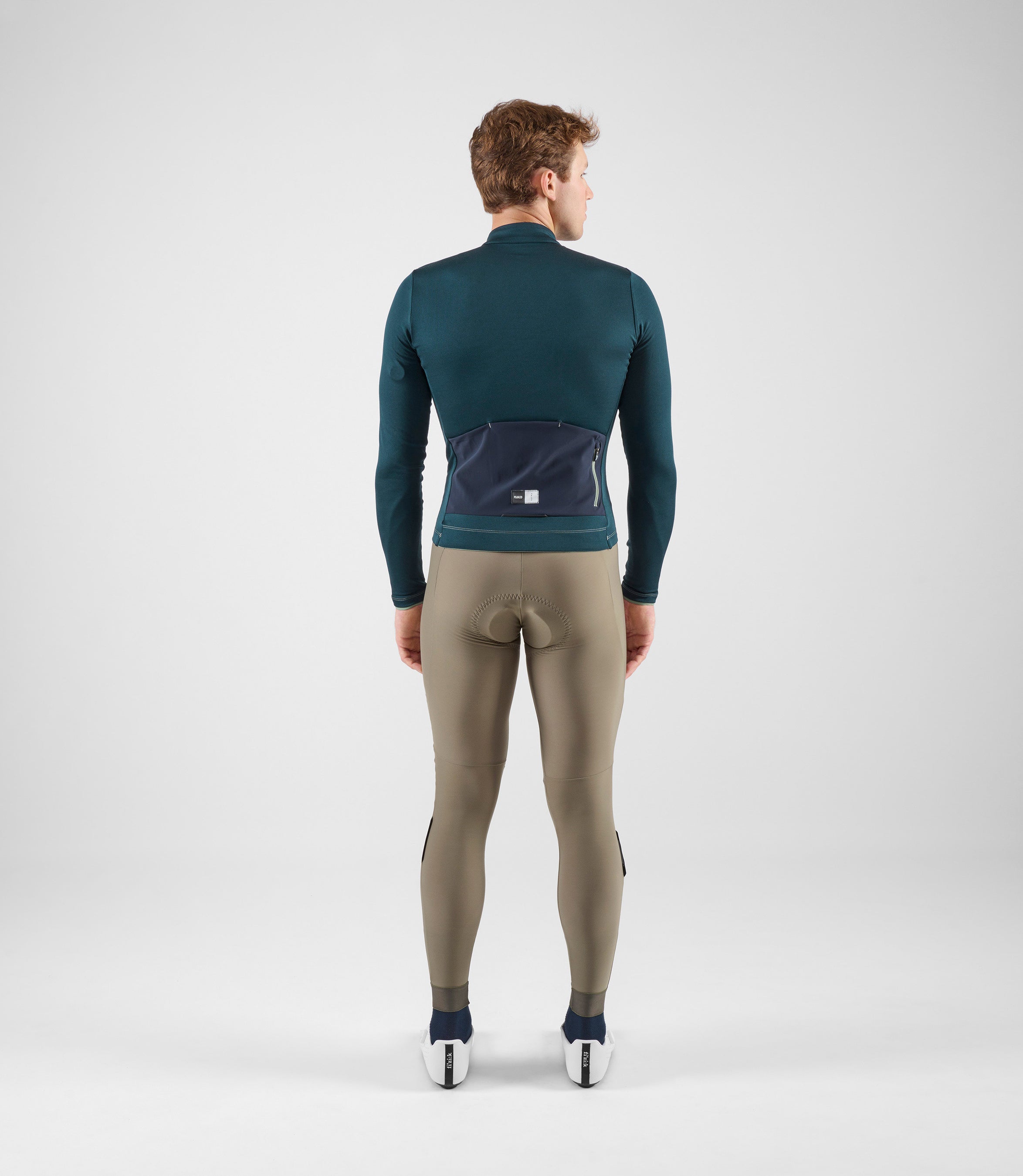 24WMJEL05PE_4_men cycling jersey merino long sleeve navy element total body back pedaled