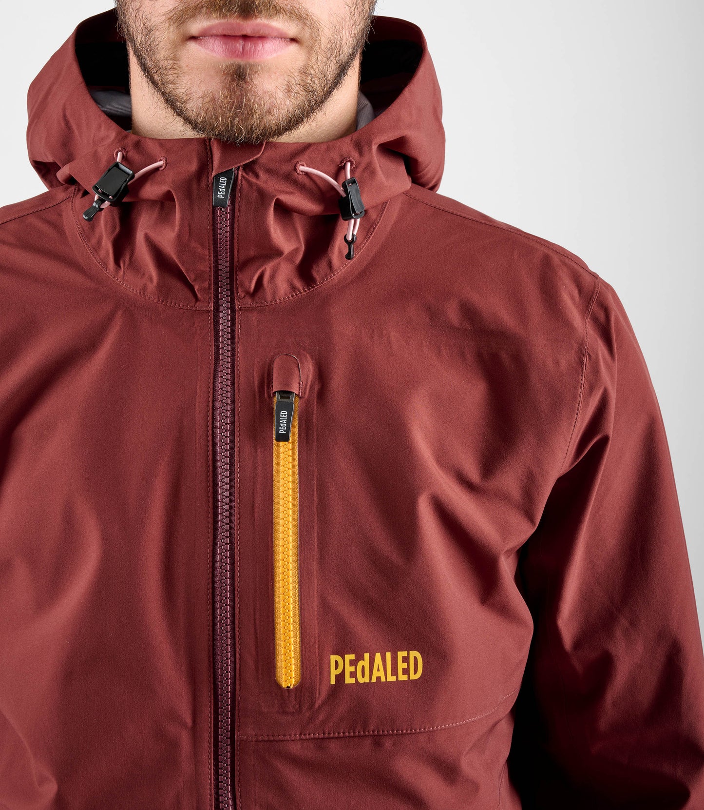 24WSJOD75PE_6_men cycling waterproof shell jacket red odyssey front zip pedaled