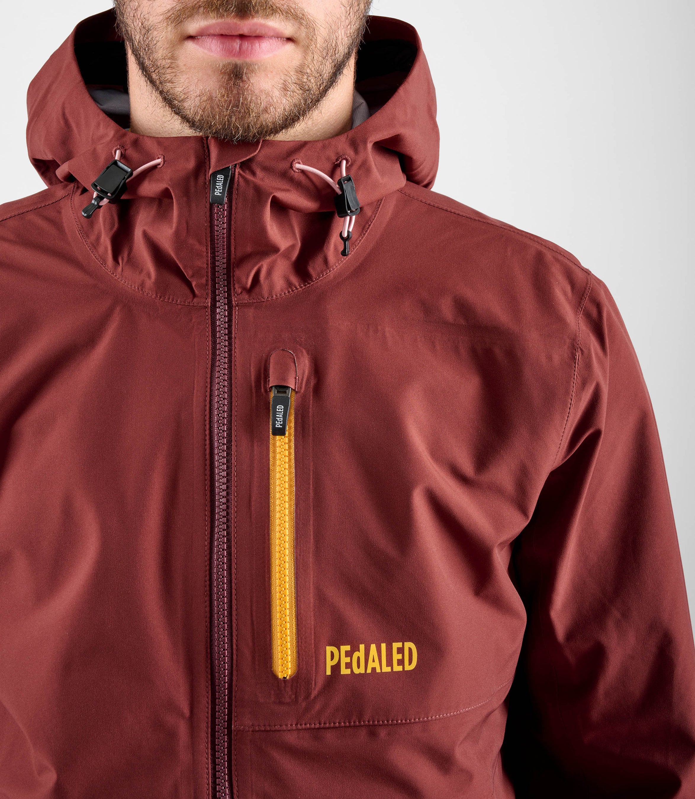 24WSJOD75PE_6_men cycling waterproof shell jacket red odyssey front zip pedaled