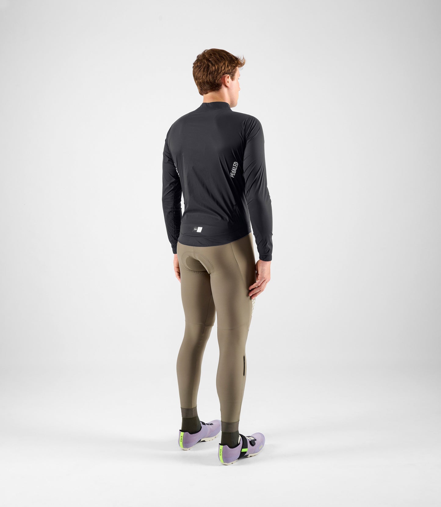 24WWJEL00PE_4_men cycling waterproof jacket black element total body back pedaled