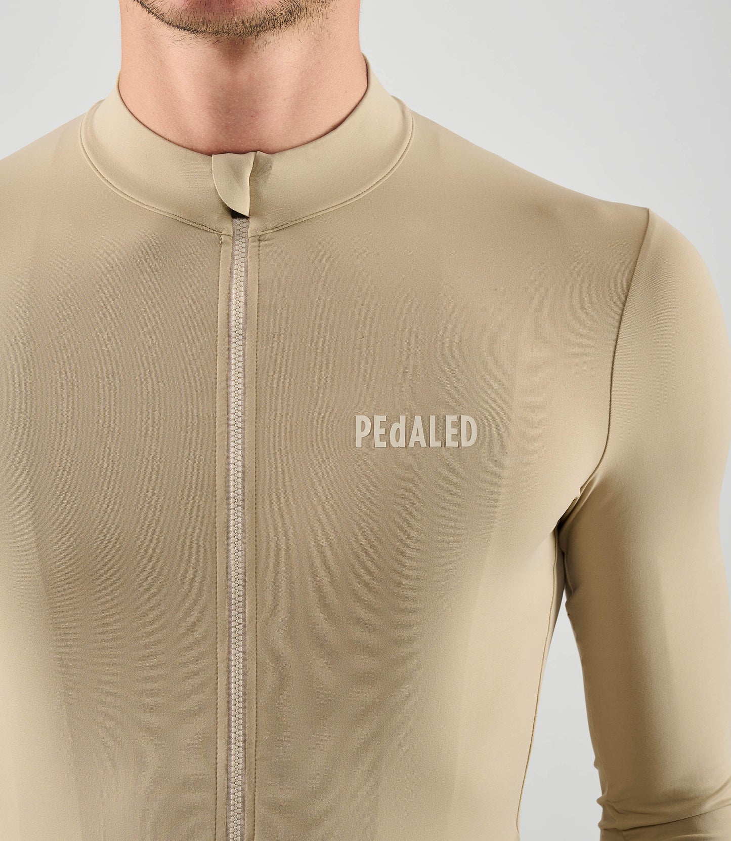 25WJSEL04PE_8_men cycling jersey long sleeve beige element front pedaled