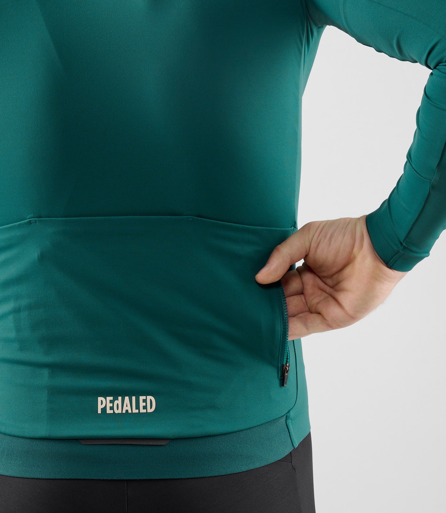 25WJSEL18PE_8_men cycling jersey long sleeve teal element back pocket detail pedaled