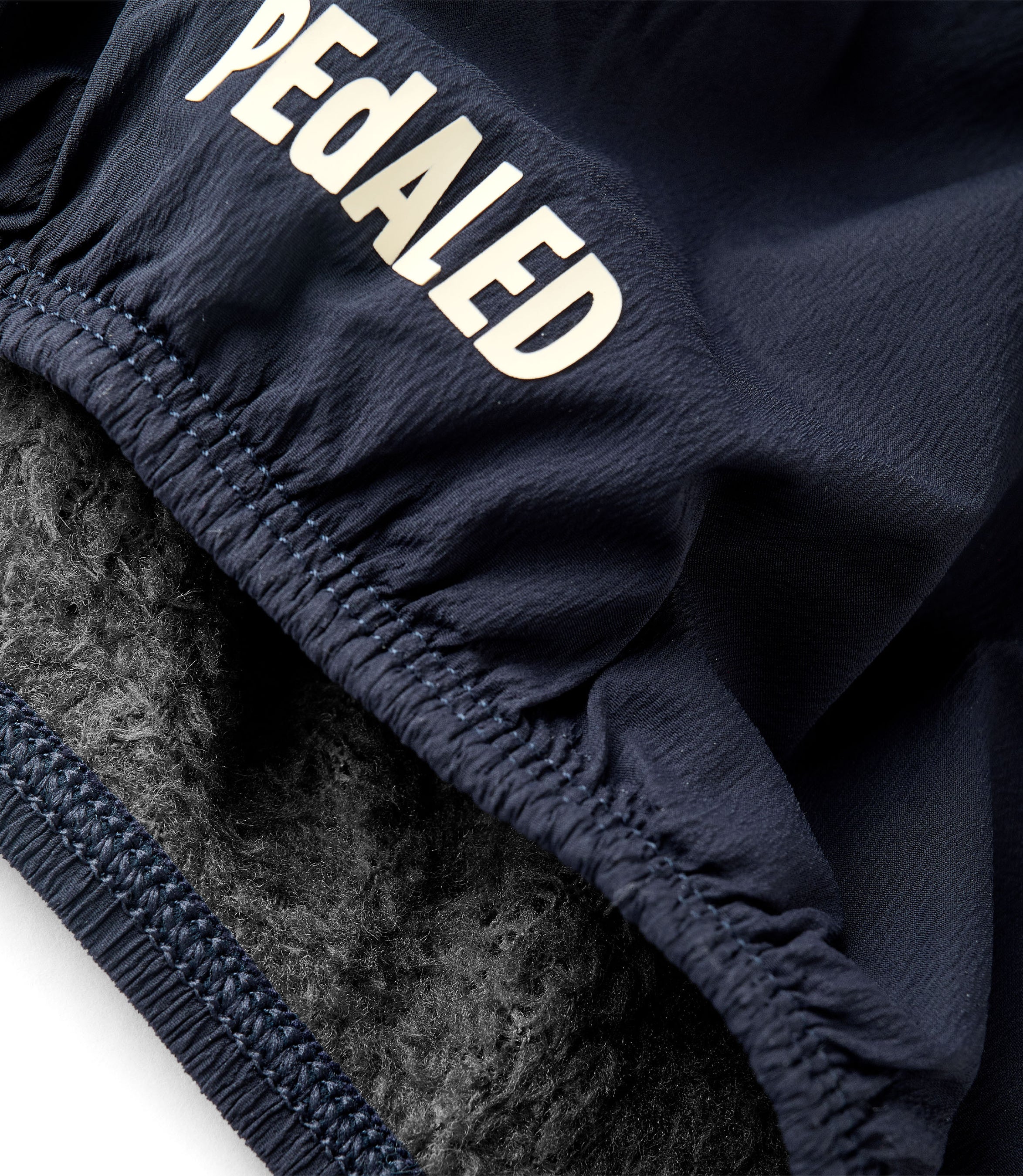 25WNWOD74PE_3_cycling neck warmer insulated alpha dark navy odyssey detail 3 pedaled