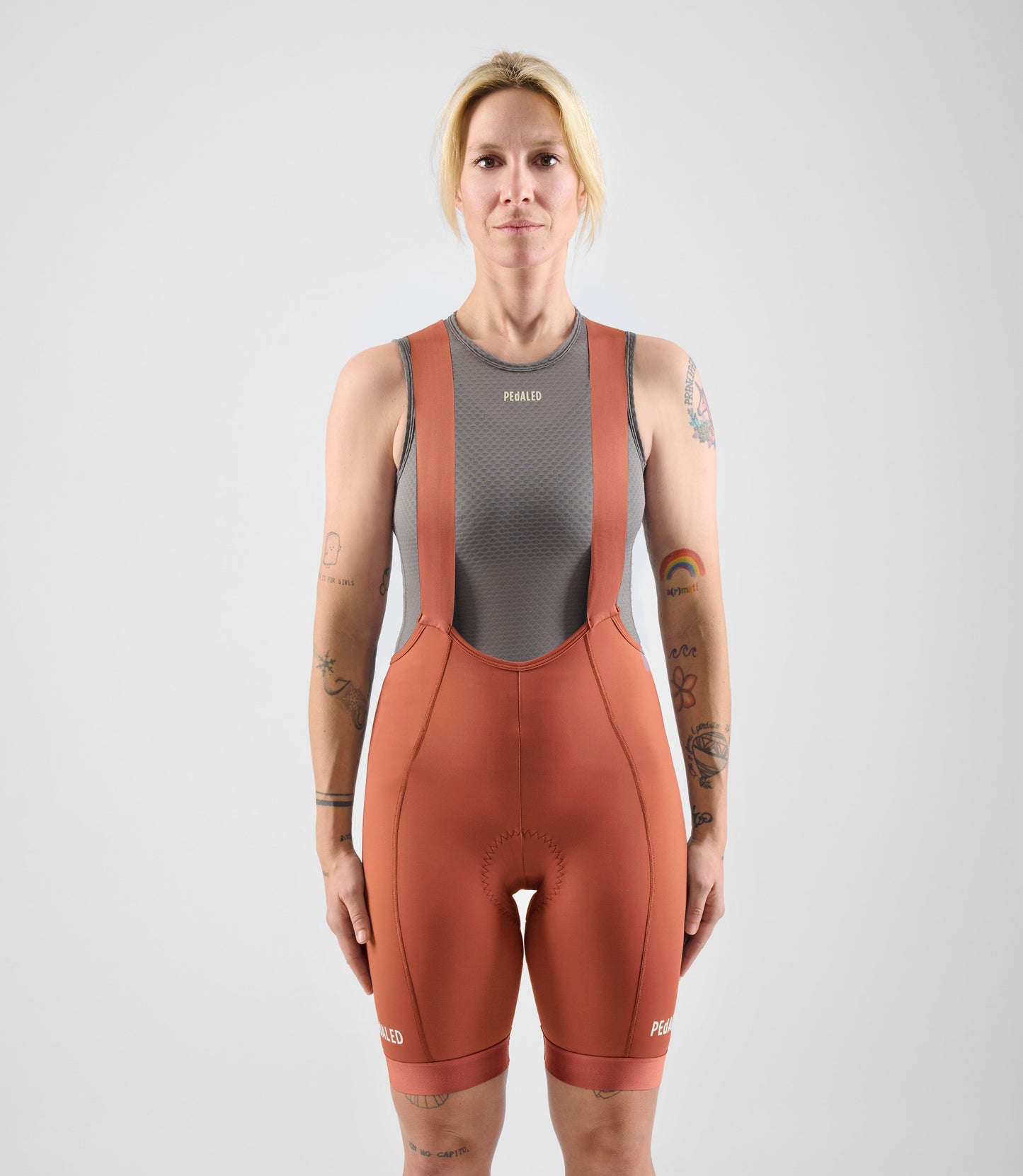 W4SBBEL12PE_3_women cycling bibshorts element orange total body front pedaled