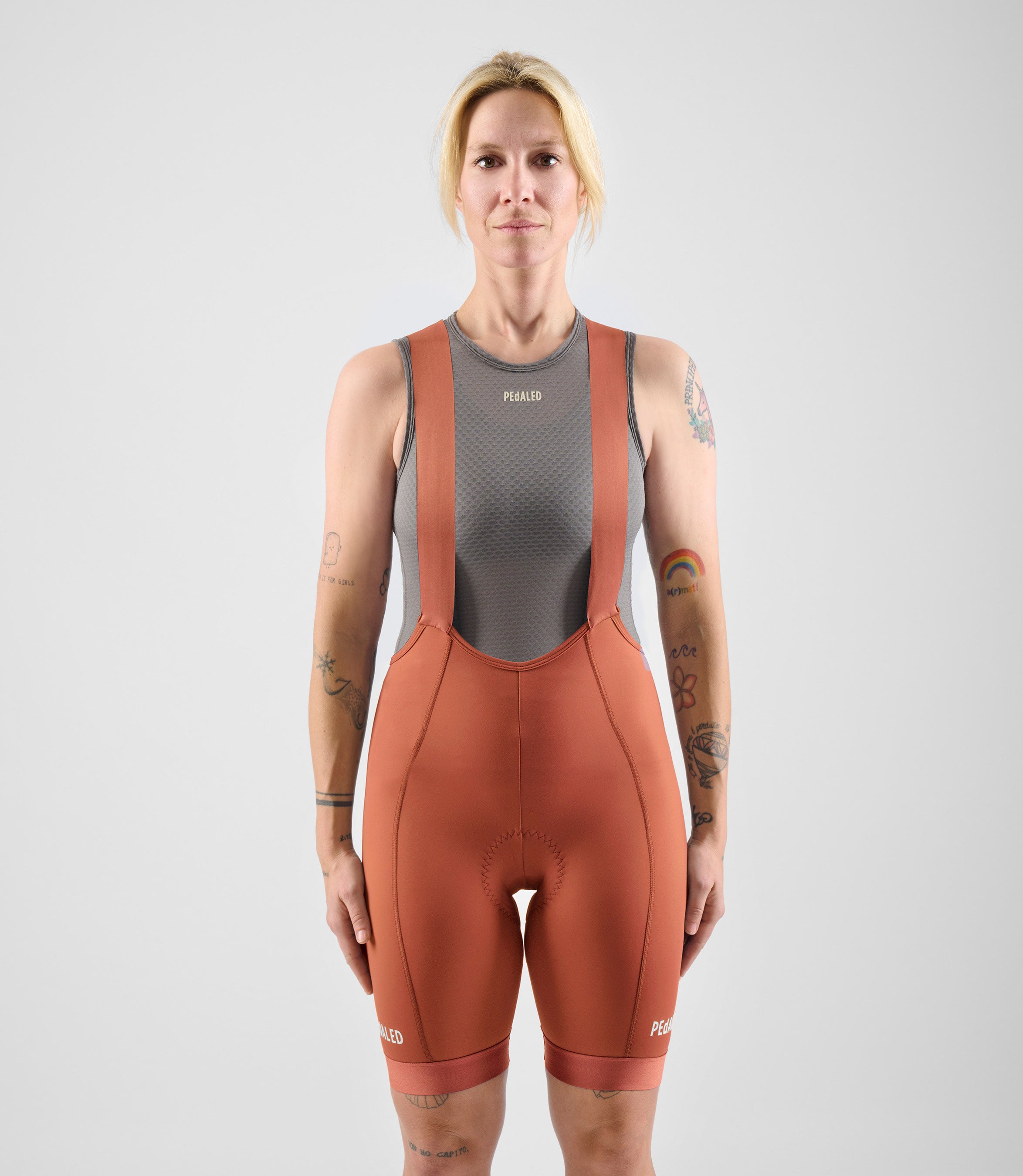 W4SBBEL12PE_3_women cycling bibshorts element orange total body front pedaled