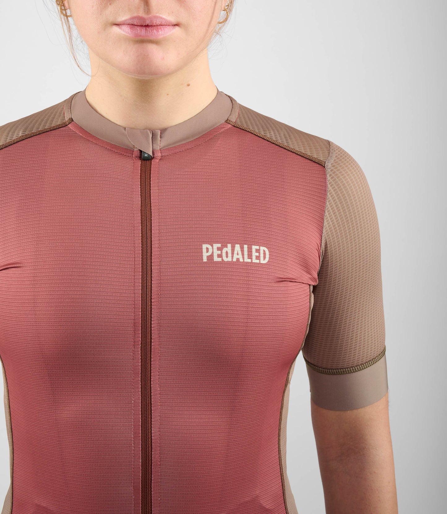 W4SJSEL14PE_5_cycling jersey women brown element front pedaled