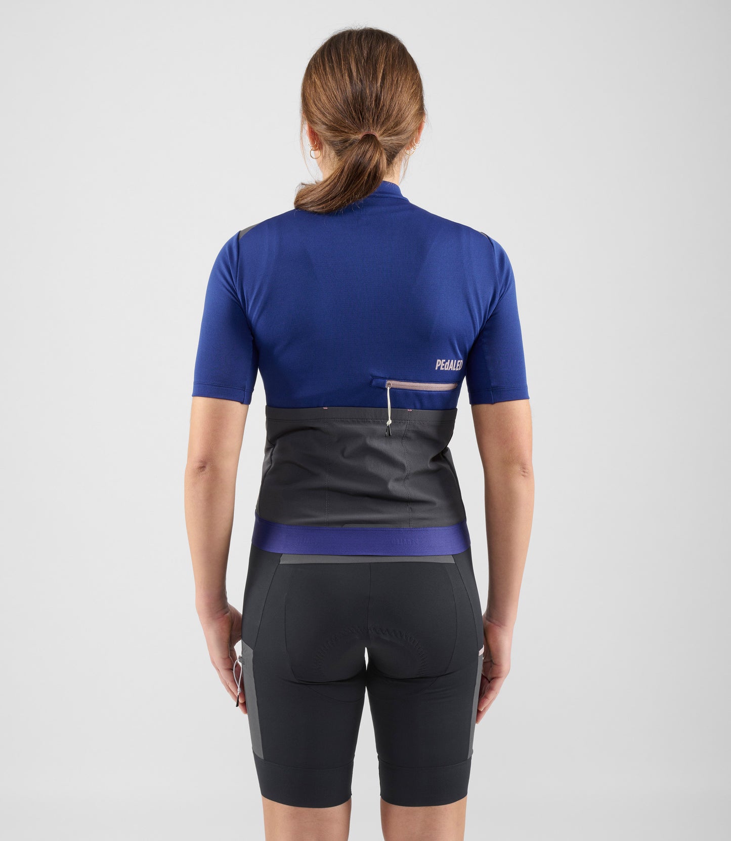 W4SMJOD07PE_4_women cycling merino jersey blue odyssey total body back pedaled