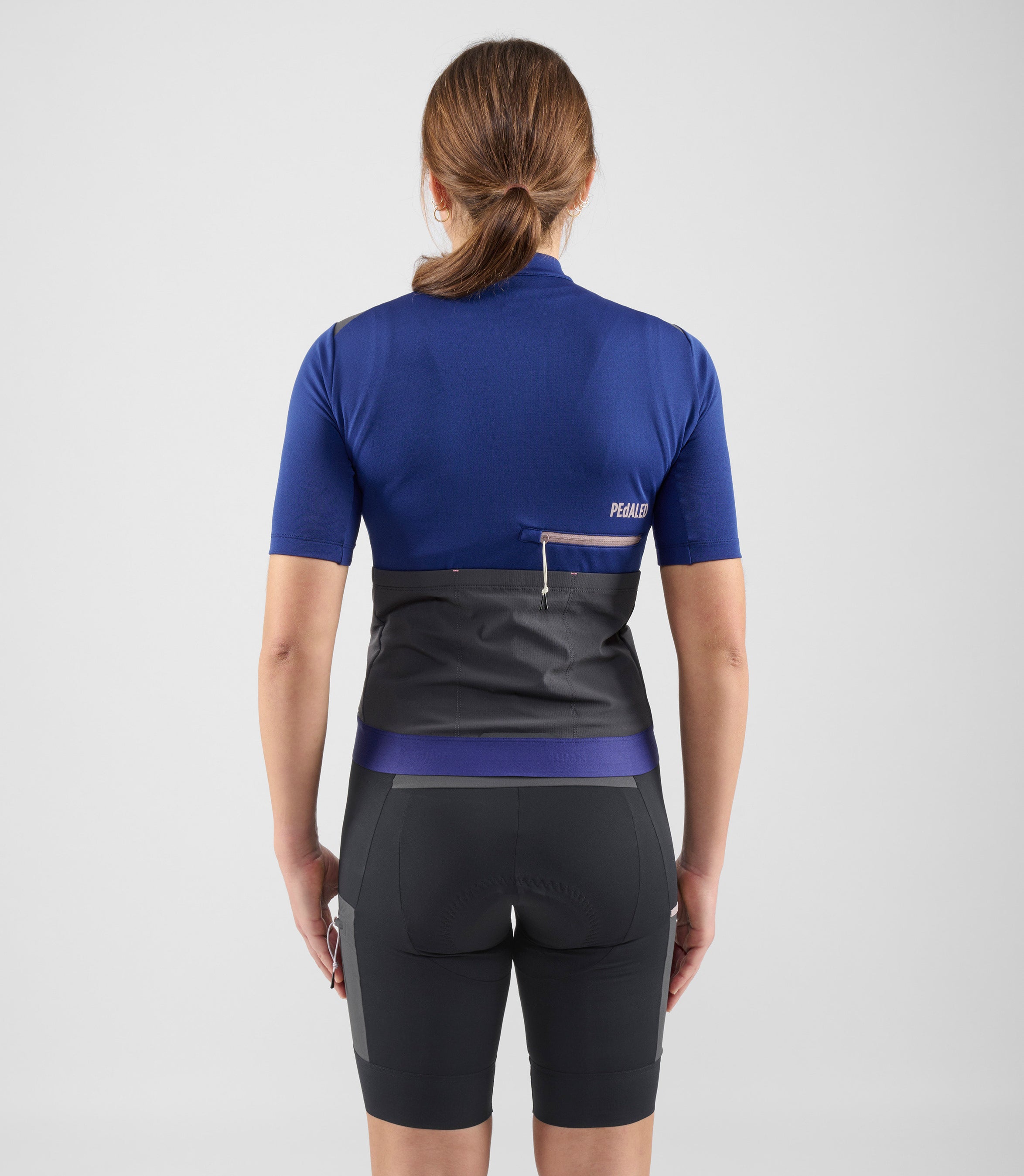 W4SMJOD07PE_4_women cycling merino jersey blue odyssey total body back pedaled