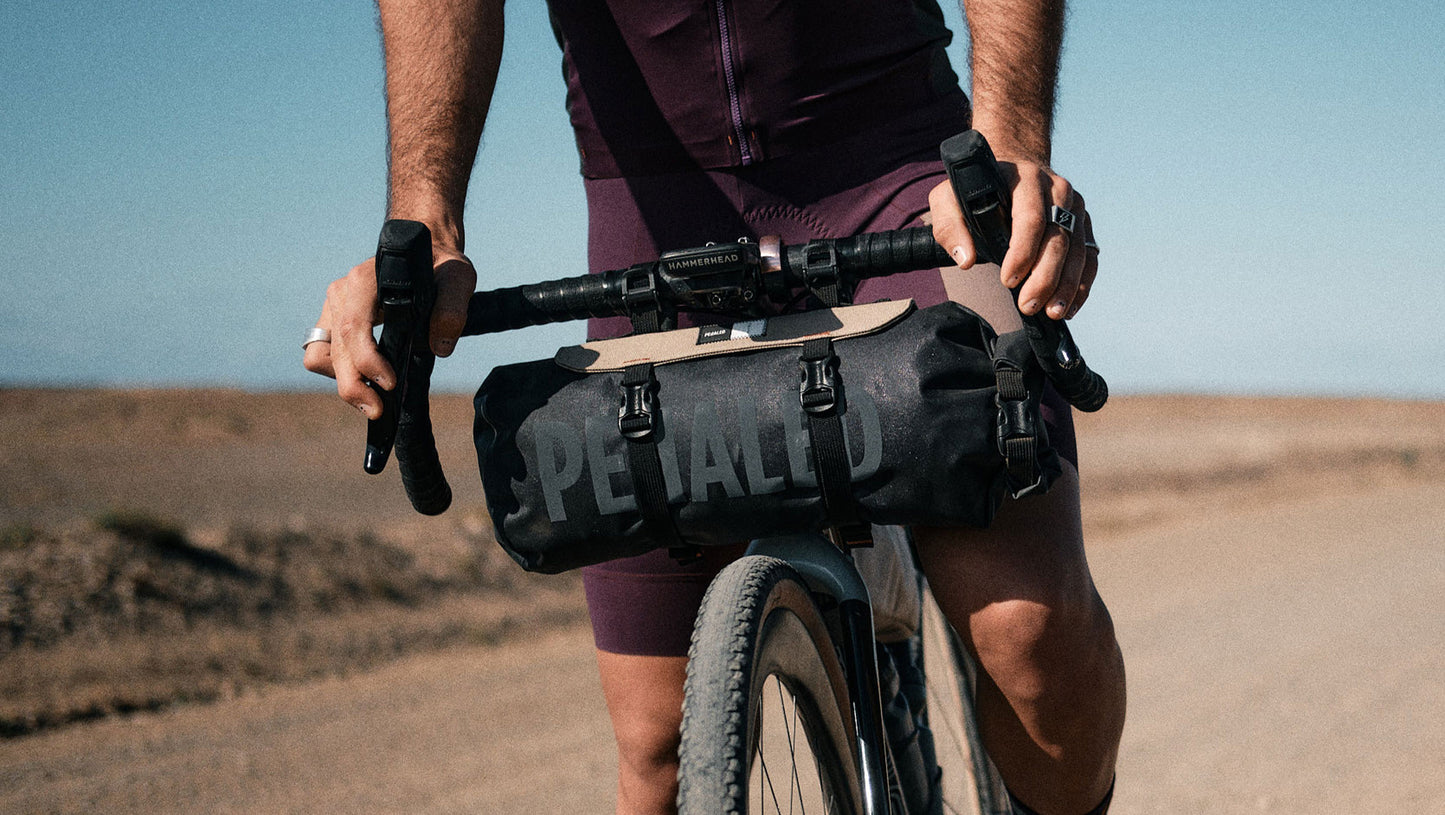 234HBOD23PE_5_odyssey handlebar bag desert shooting pedaled 1