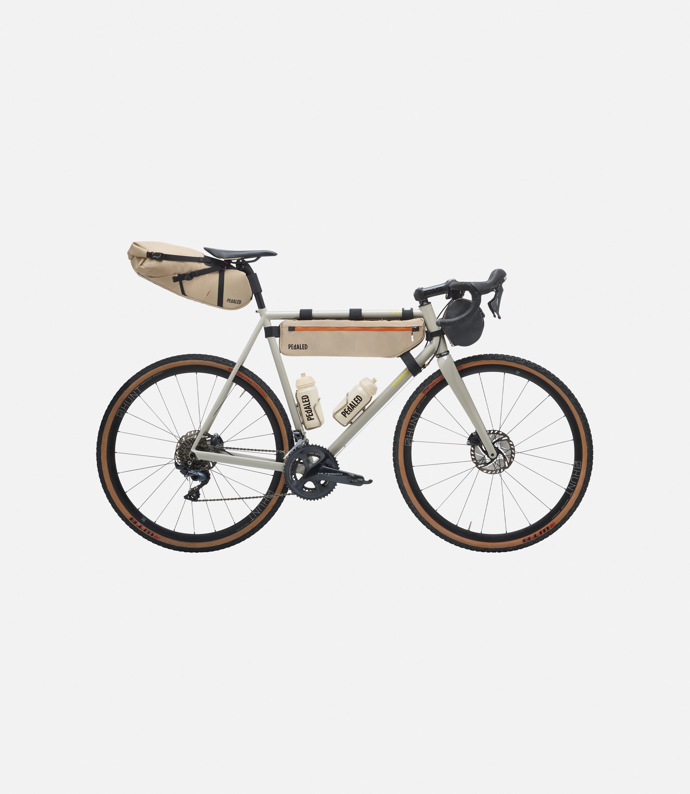 234SBOD56PE_2_bikepacking bag complete kit desert front pedaled 2