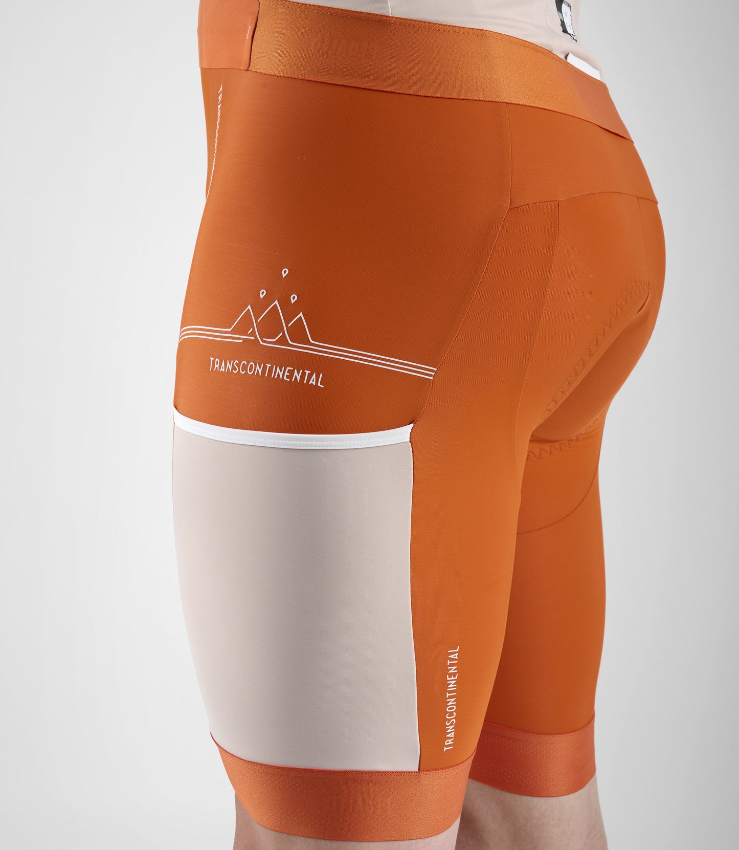 23SBBTC12PE_8_men cycling bib shorts transcontinental orange left pocket pedaled