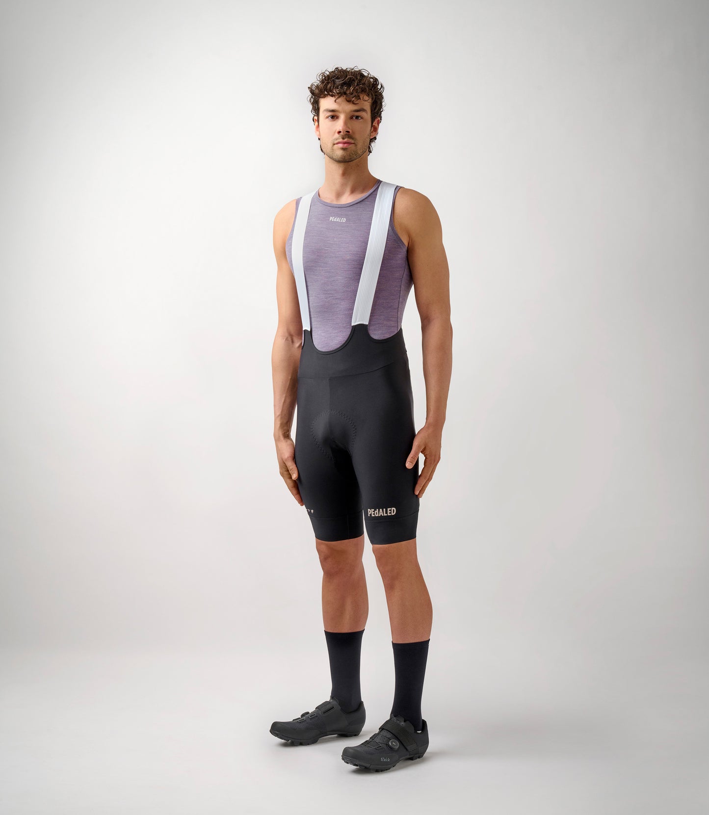 23SBLEM0IPE_3_men cycling merino base layer lilac essential total body front pedaled