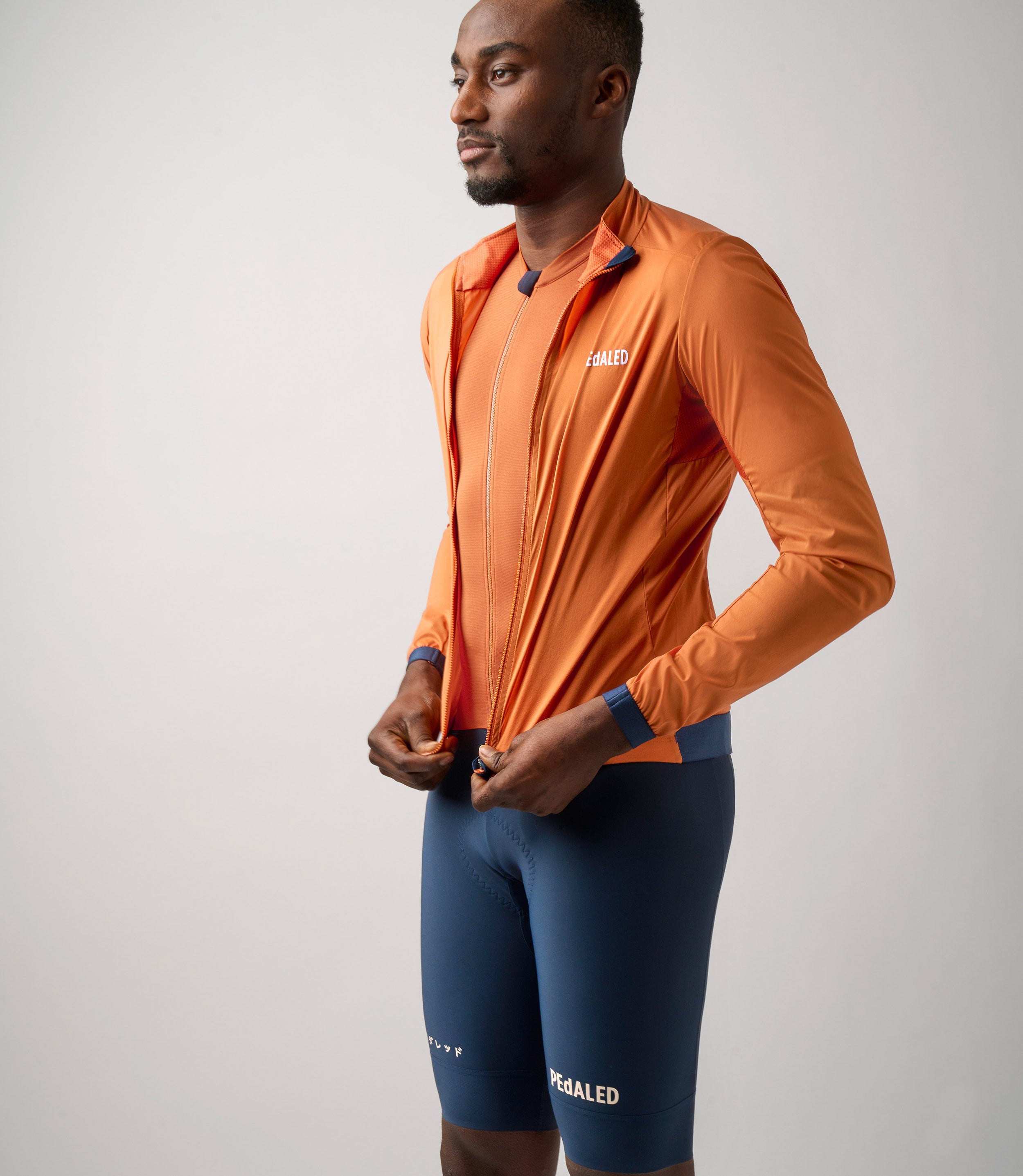 Orange cycling jacket shop