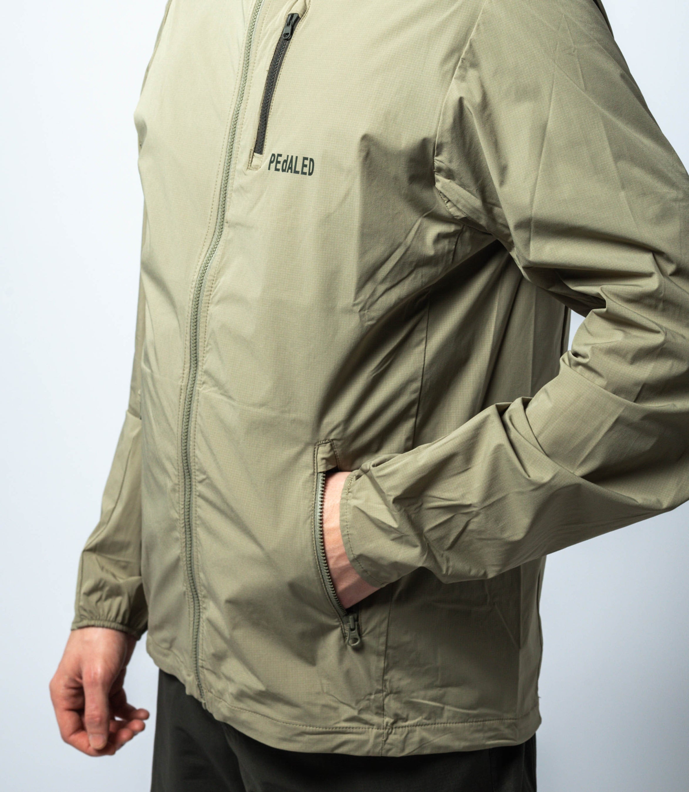 23SJKJA69PE_6_cycling jacket packable green jary side pocket pedaled