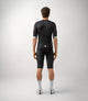 23SJSES00PE_4_men cycling jersey essential black total body back pedaled