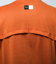 23STSJA0HPE_7_cycling gravel tech tee orange jary back logo pedaled