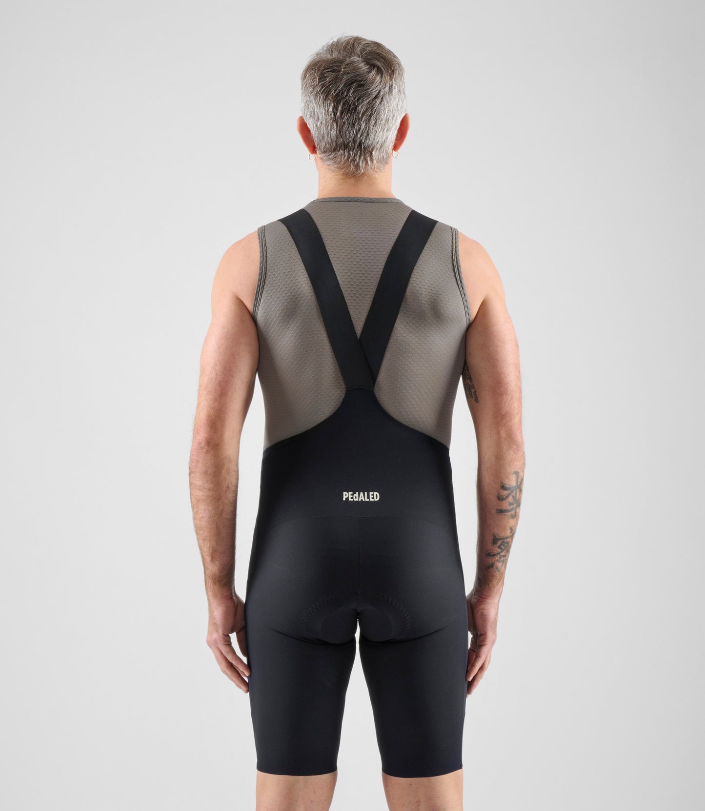 24SBLEL02PE_4_men cycling baselayer element grey total body back pedaled