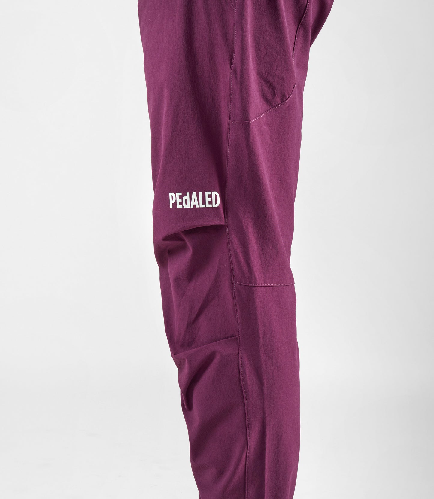 24SPAYA10PE_10_men cycling pants purple yama right leg pedaled