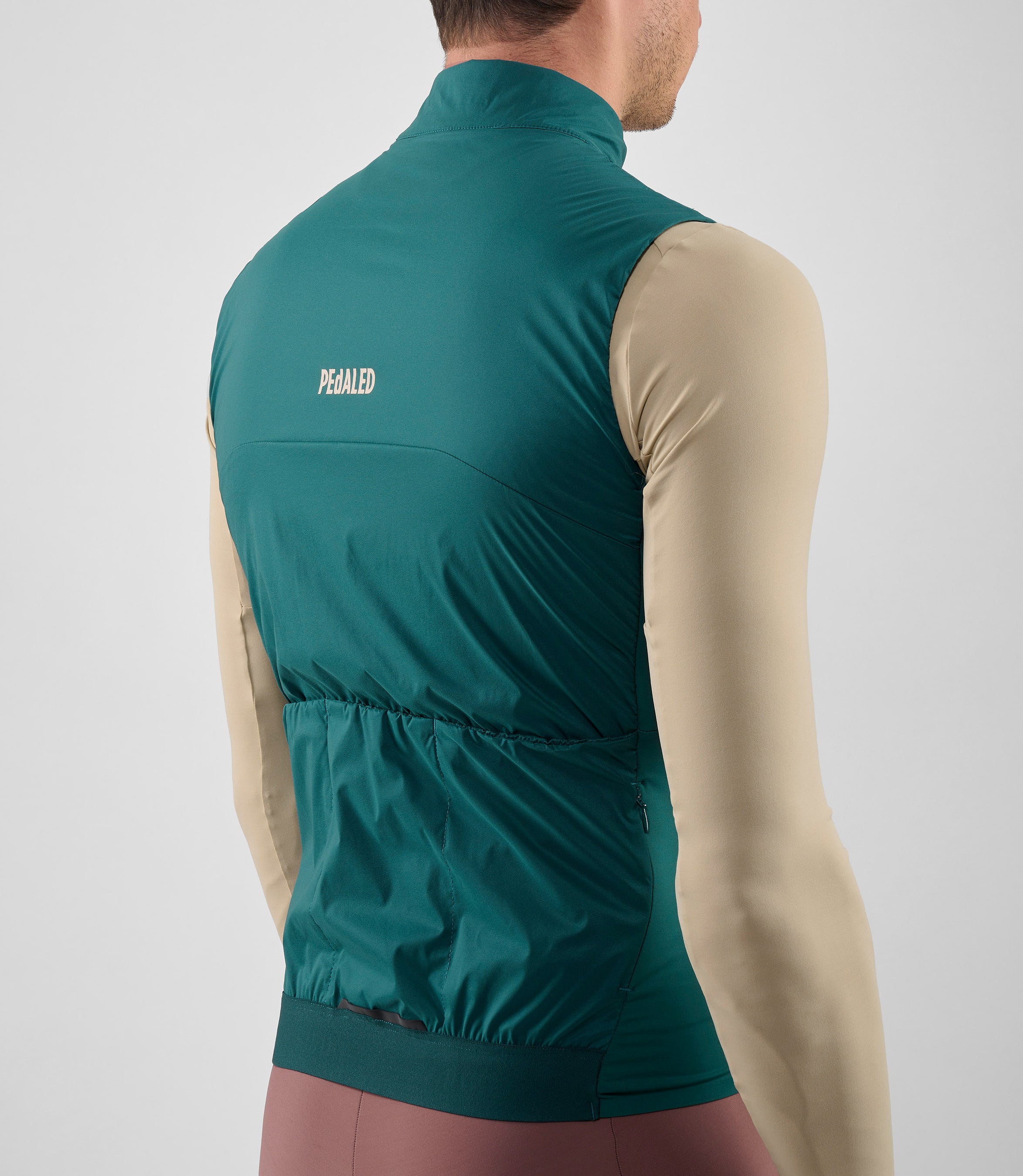25WAVEL18PE_5_men cycling vest alpha teal element back pocket pedaled