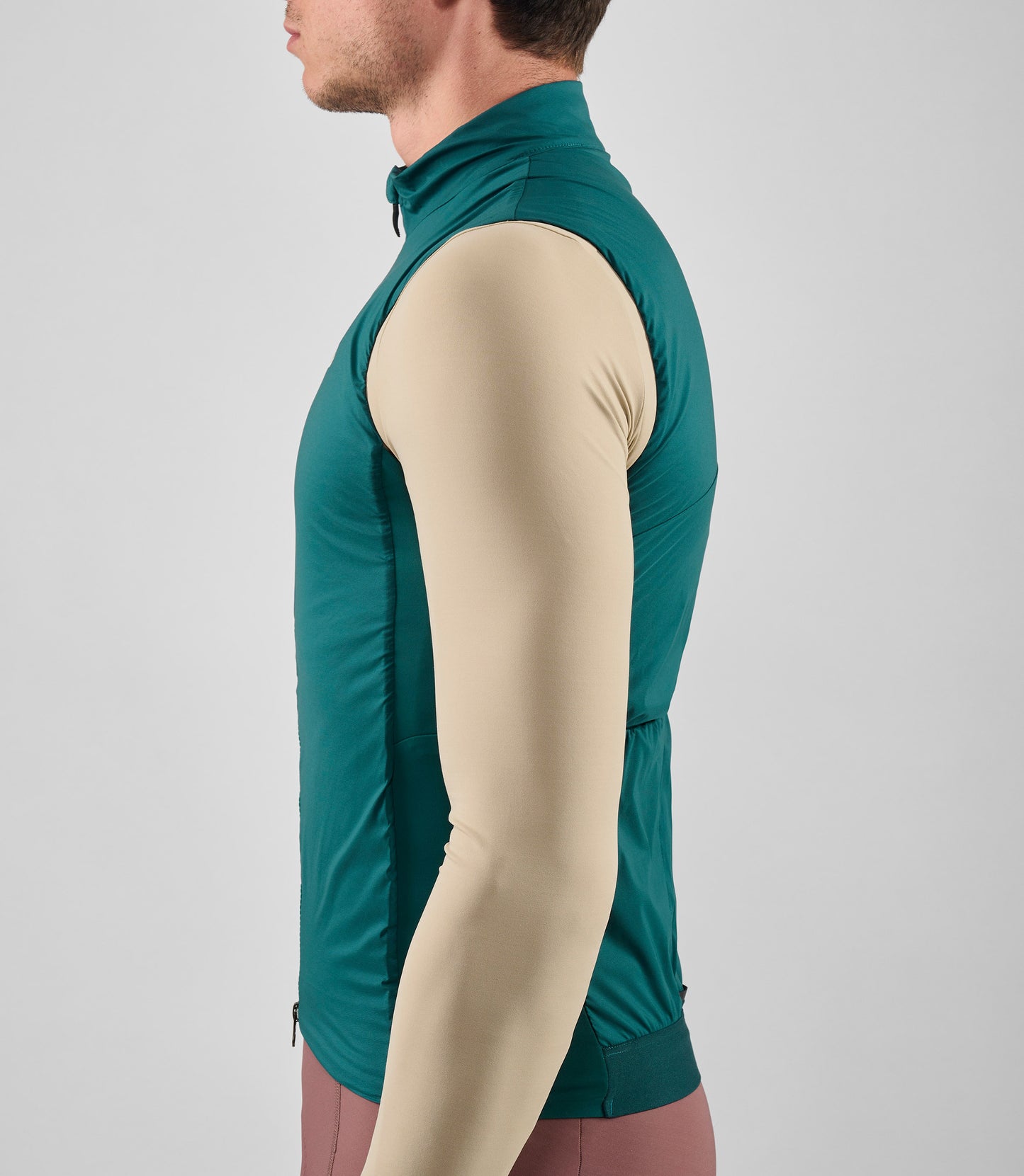 25WAVEL18PE_8_men cycling vest alpha teal element side pedaled