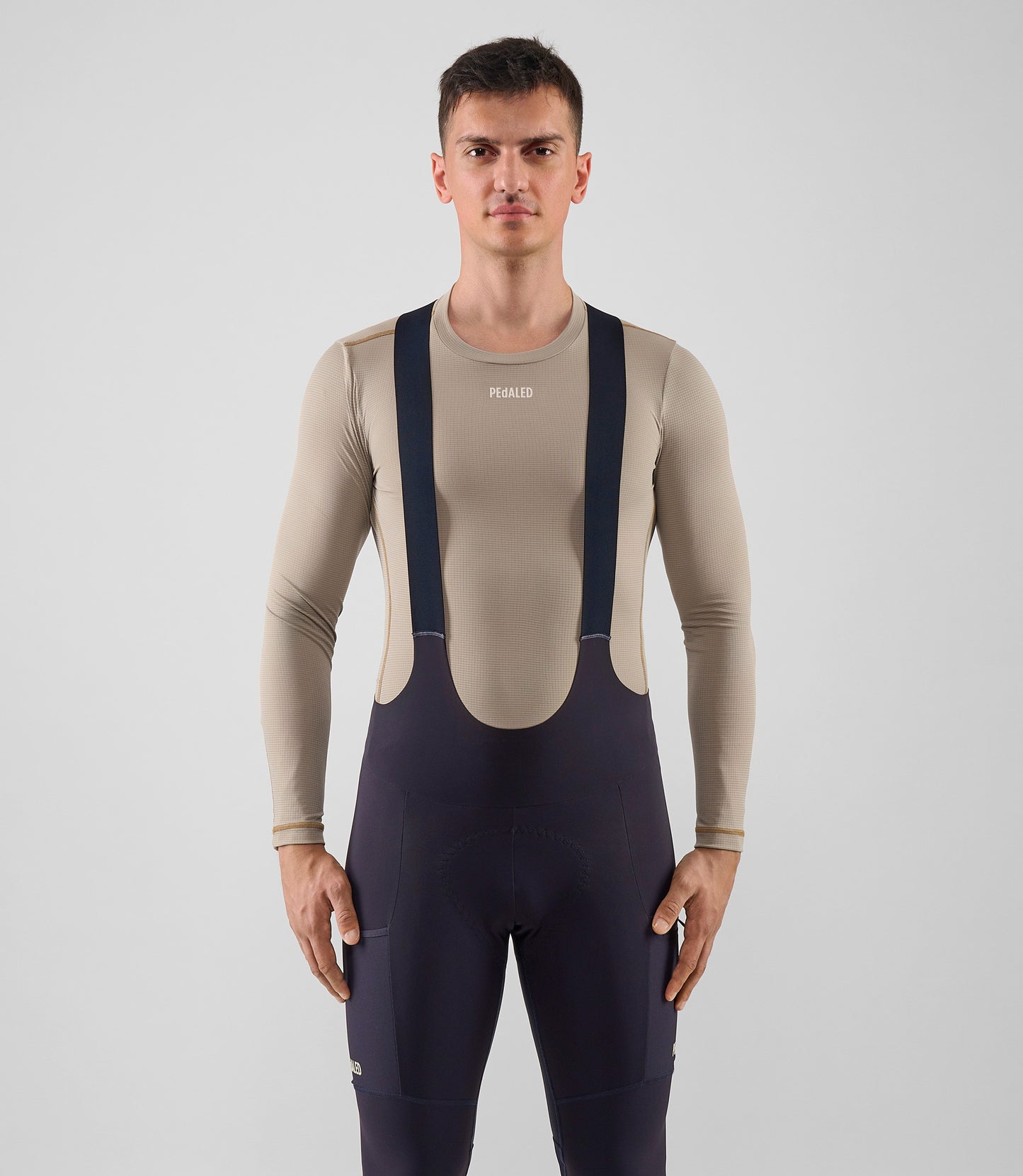 25WBLOD16PE_2_men cycling base layer long sleeve light grey ink odyssey total body front pedaled