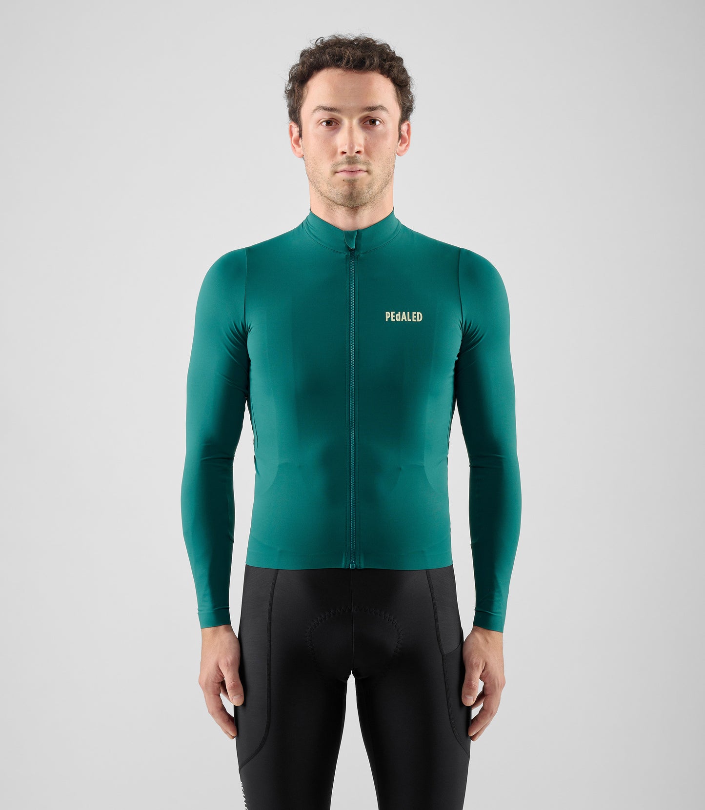 25WJSEL18PE_3_men cycling jersey long sleeve teal element total body front pedaled