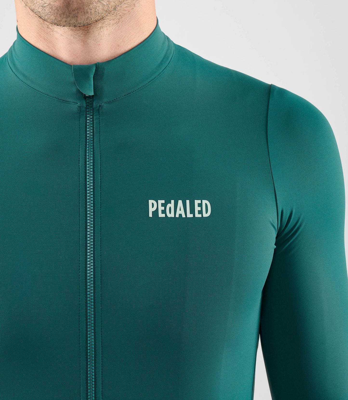 25WJSEL18PE_5_men cycling jersey long sleeve teal element front pedaled