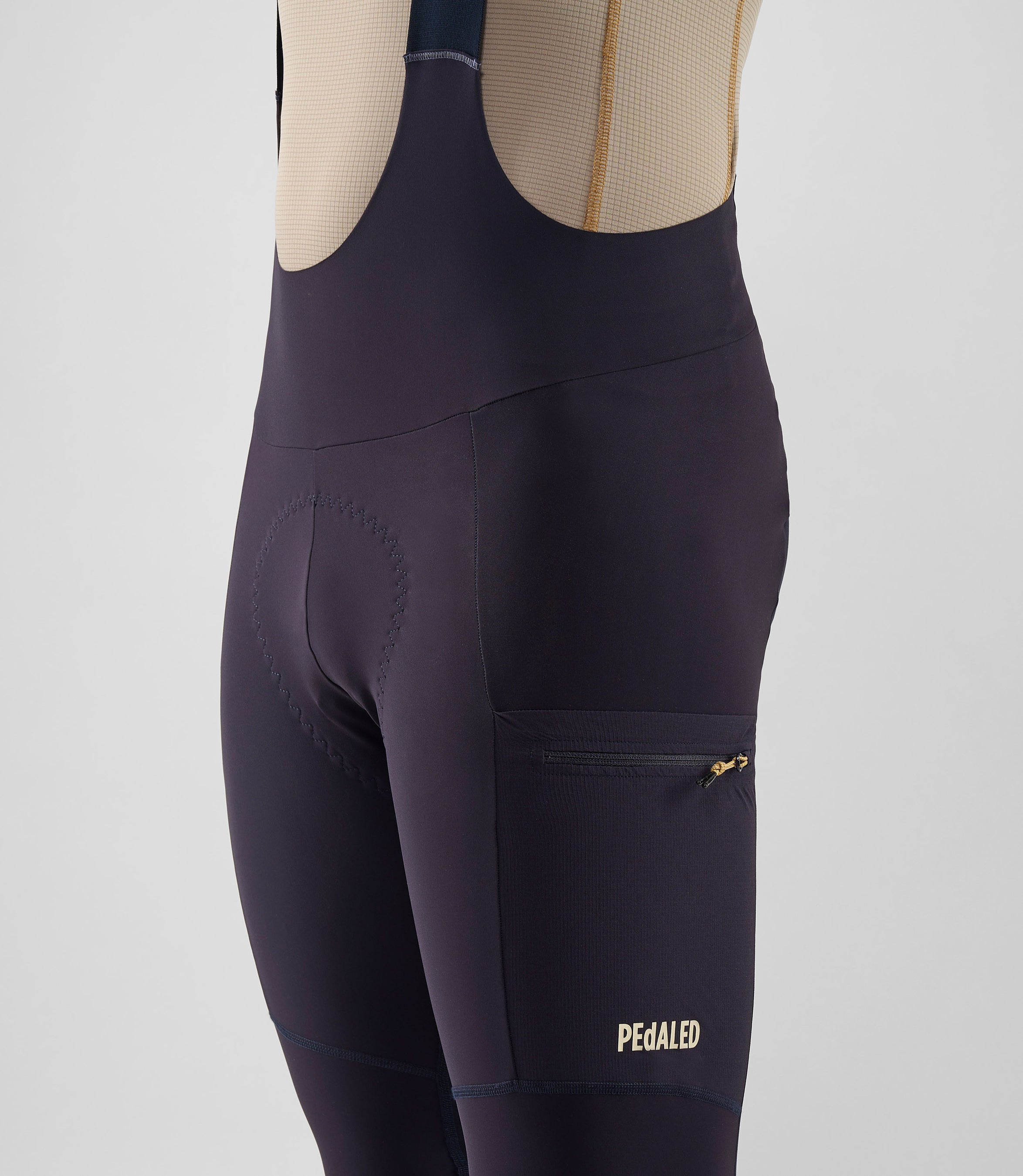 25WWTOD74PE_4_men cycling cargo bib tight dark navy odyssey front pedaled