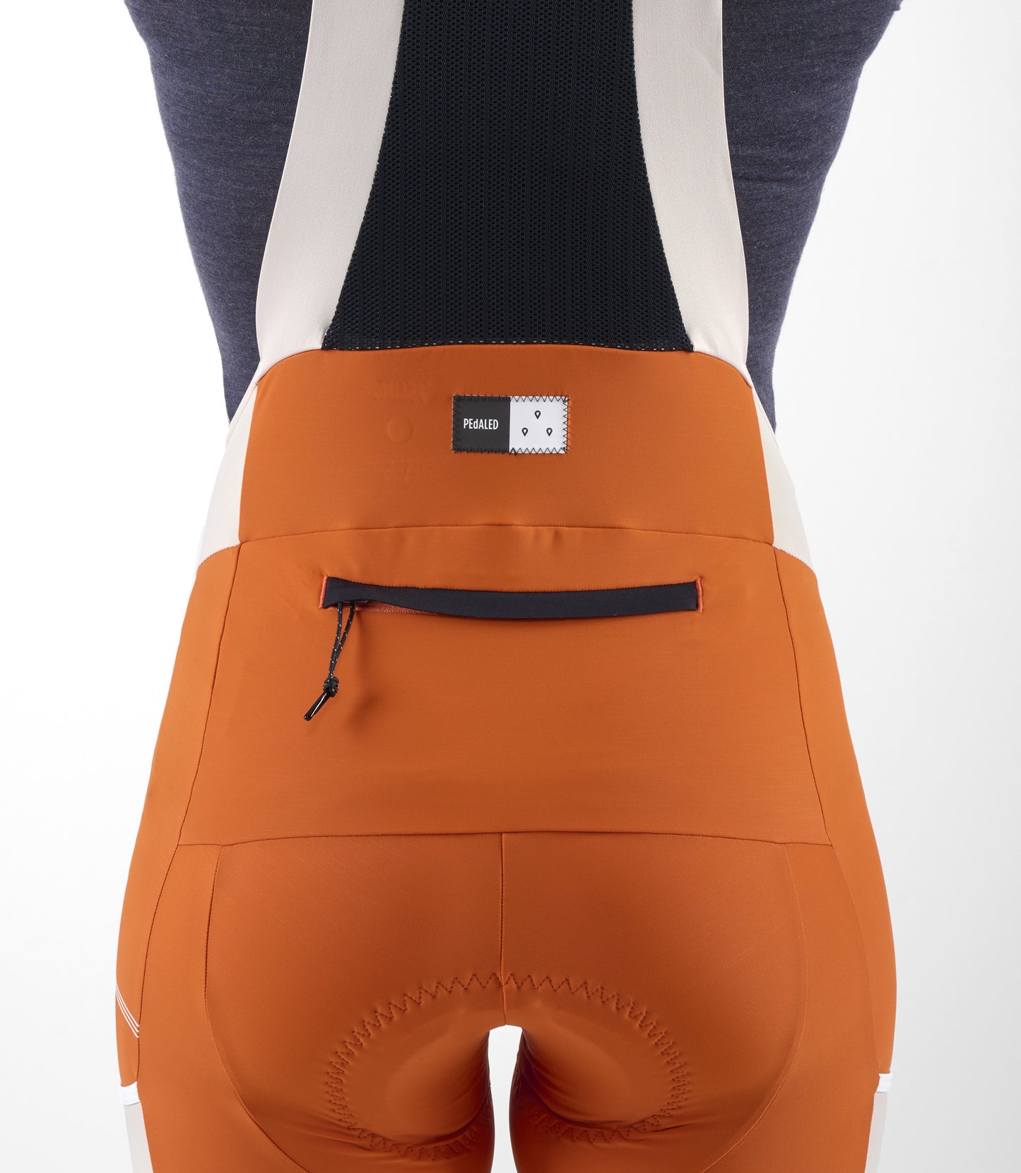 W3SBBTC12PE_9_women cycling bib shorts transcontinental orange back pocket pedaled
