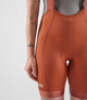 W4SBBEL12PE_4_women cycling bibshorts element orange front pedaled