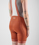 W4SBBEL12PE_6_women cycling bibshorts element orange back detail pedaled