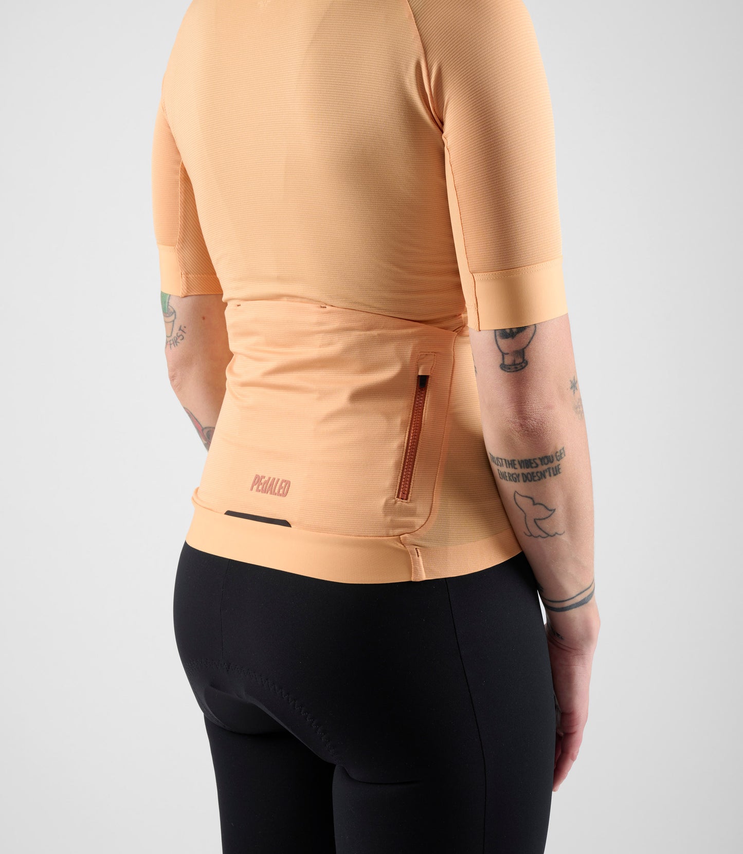 W4SLJEL0QPE_6_cycling jersey lightweight women orange element back pocket pedaled