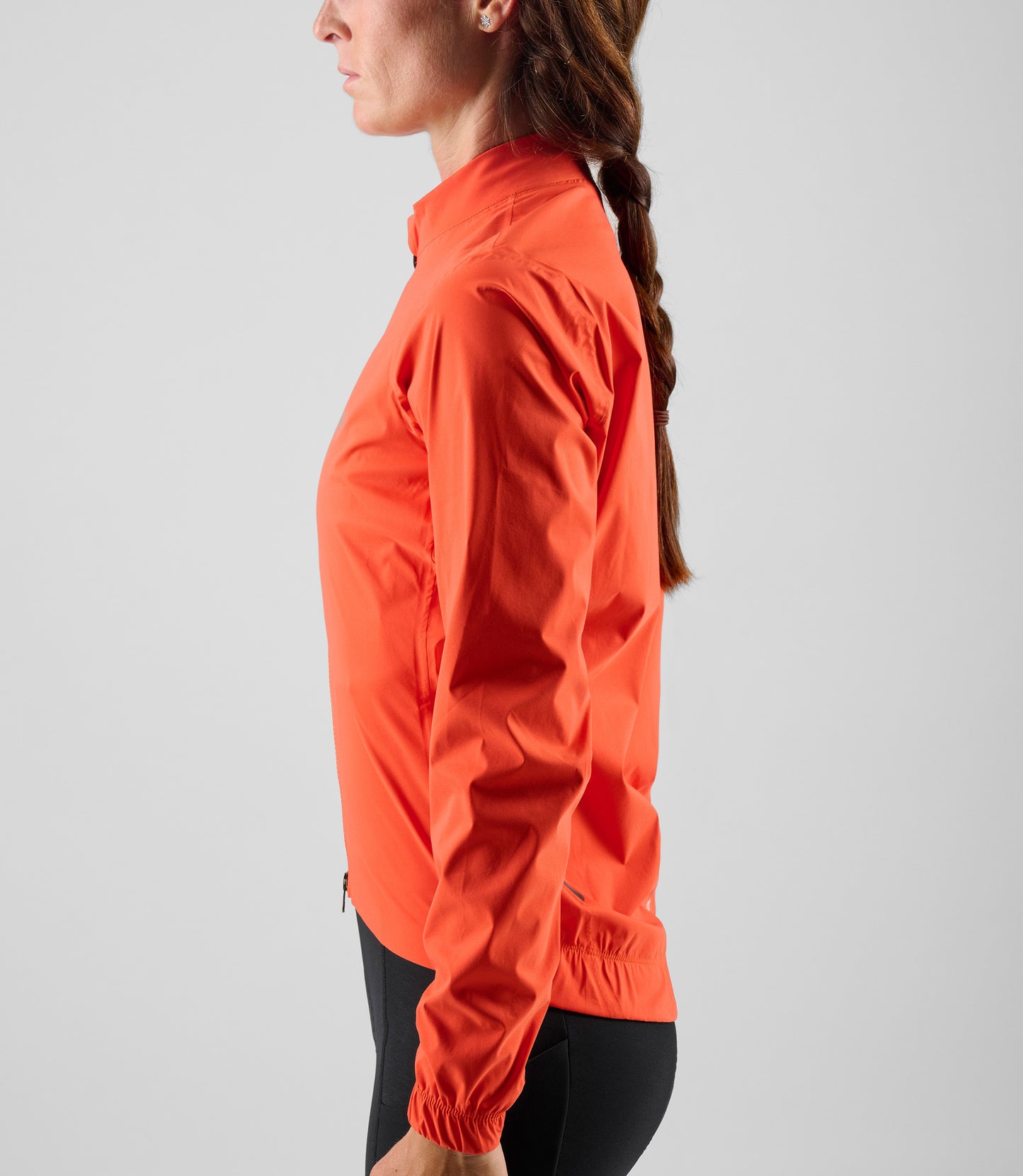W5WWJEL12PE_6_women cycling waterproof jacket orange element side pedaled