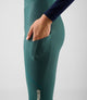 W5WWTEL18PE_8_women cycling bibtight teal element side pocket hand pedaled